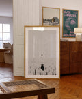 A motivational art print depicting a flock of sheep following a human, while one black sheep stands facing the opposite direction. Symbolizing individuality, courage, and breaking free from the crowd, this striking artwork serves as a reminder to think independently and stand out. Perfect for office or home décor.