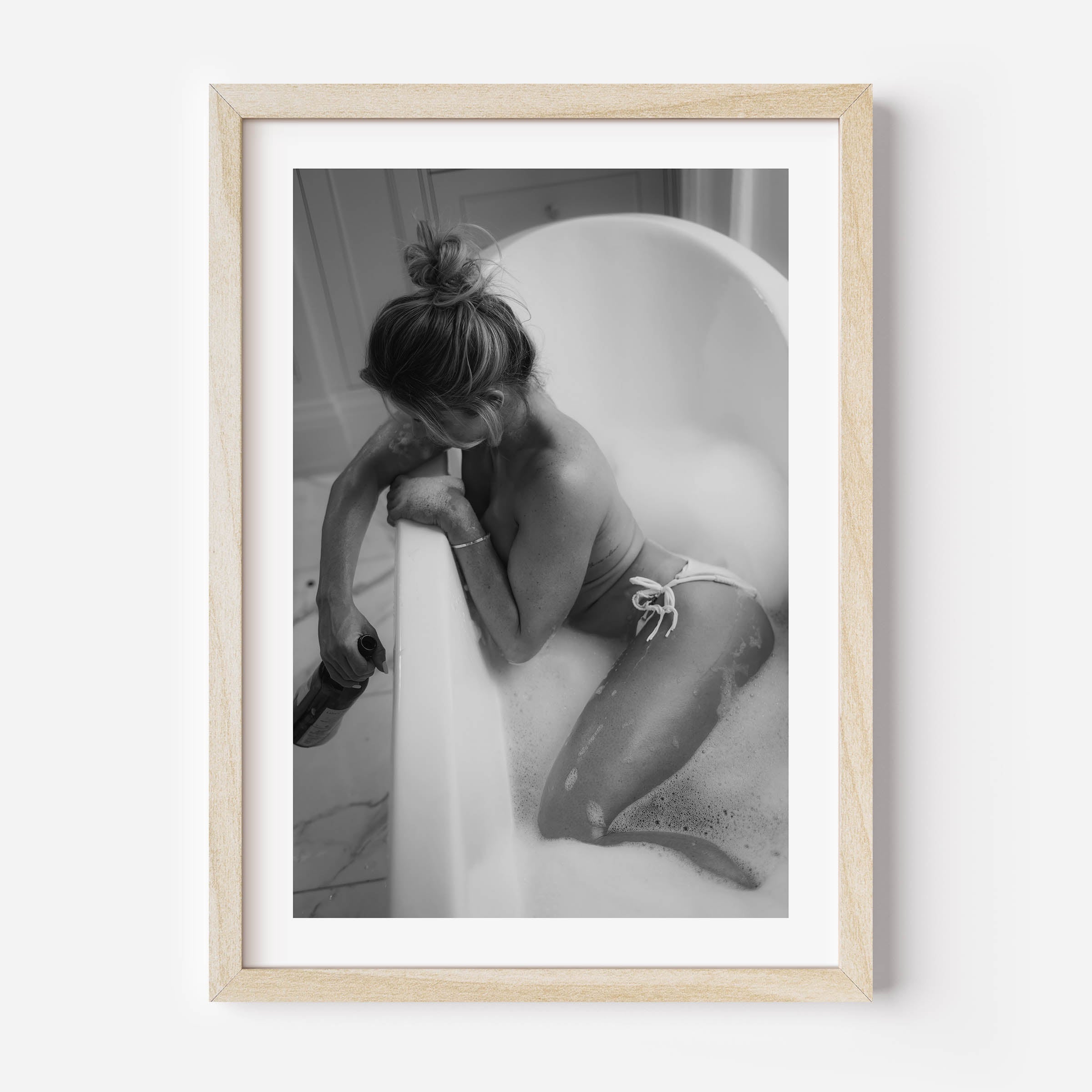Fine art black-and-white print of a woman in a bathtub. Minimalist, sensual, and elegant — perfect wall art for modern interiors. Museum-quality print