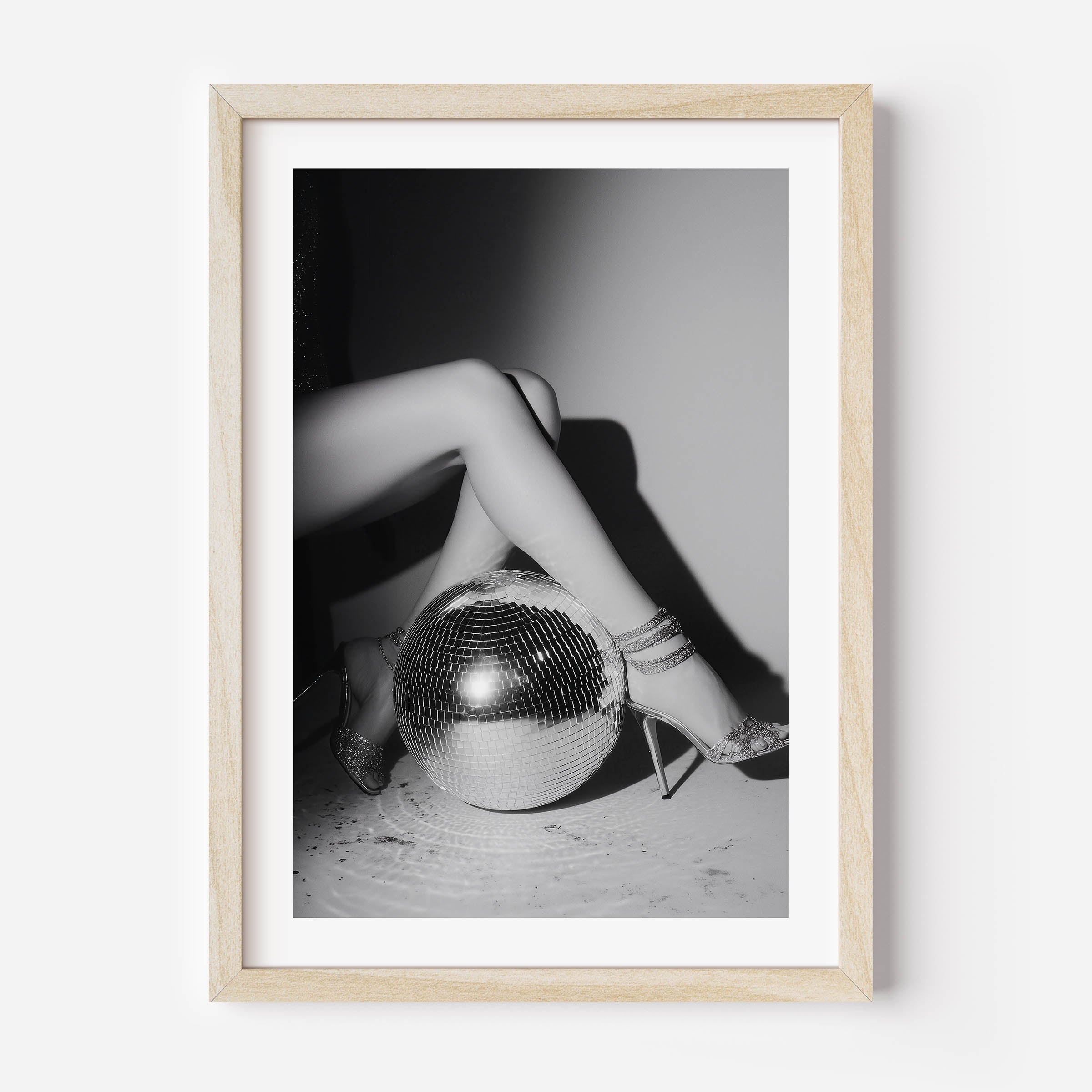Bring the party home with this glamorous black-and-white fine art print featuring glittering heels and a disco ball. Perfect for bold, stylish interiors.