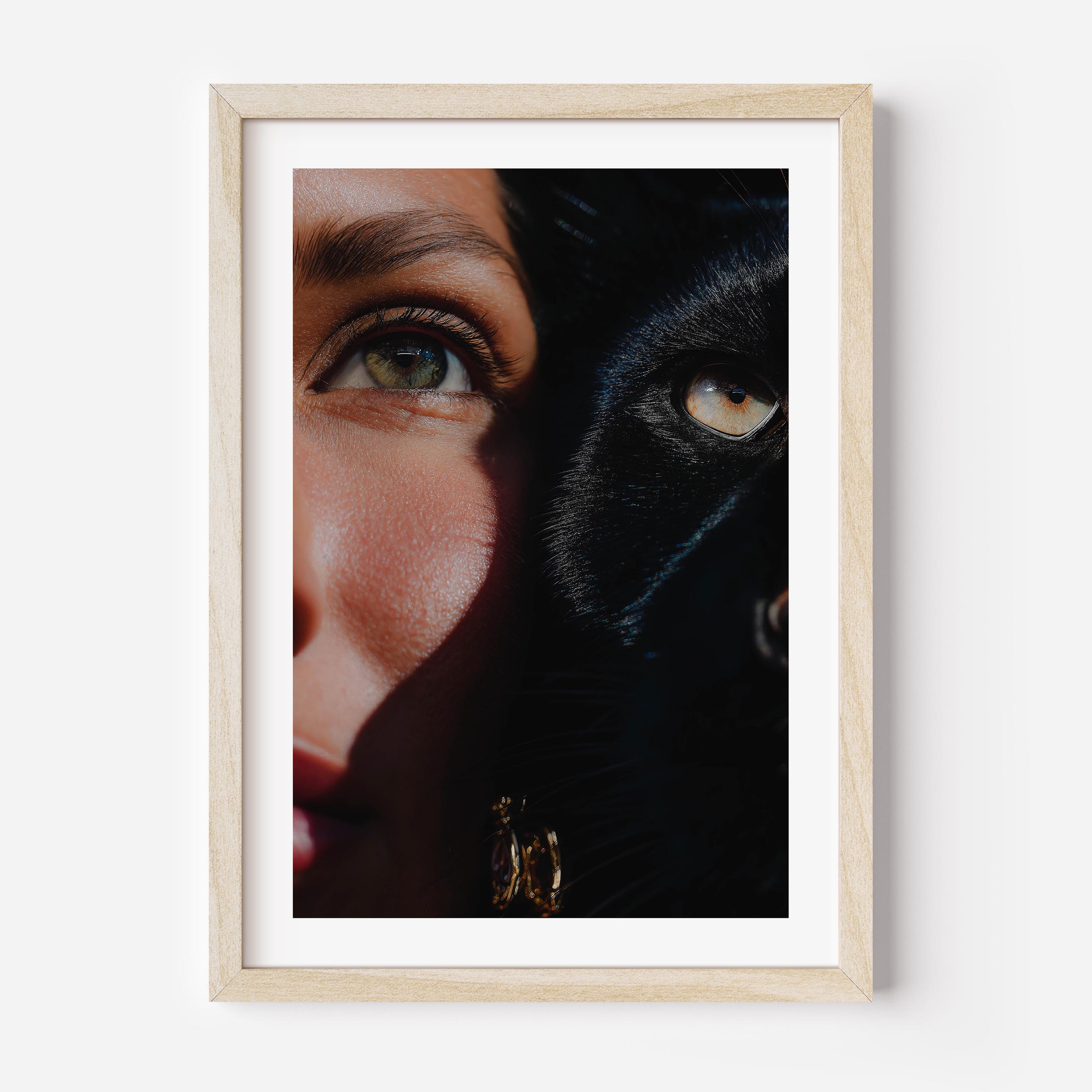 This fine art print features a powerful close-up of a woman and a black cat, their eyes aligned in perfect harmony. The rich shadows and sharp detail create a dramatic, gallery-worthy aesthetic that elevates any modern interior.