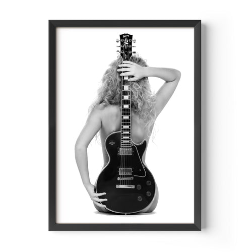 Black-and-white fine art print of a figure from behind holding an electric guitar on a white background.