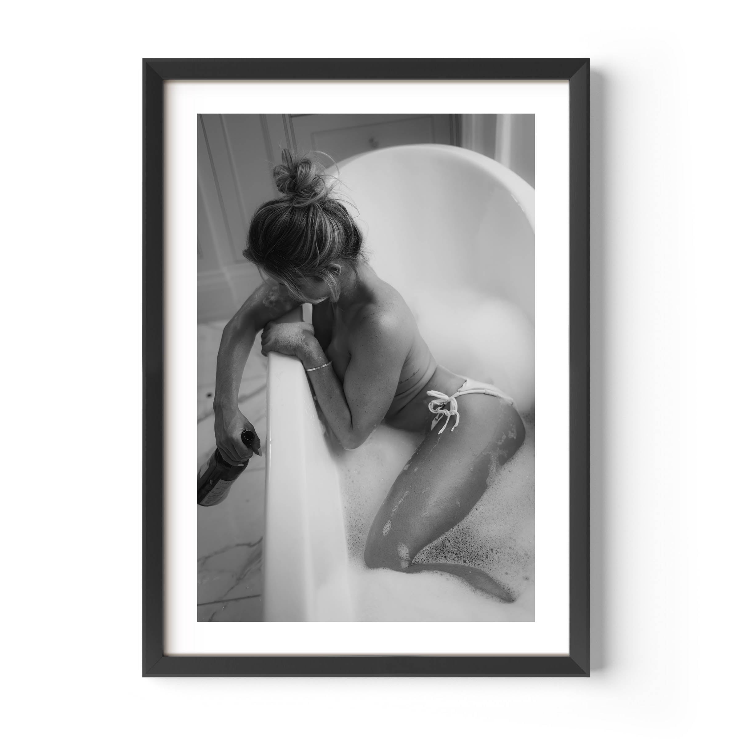Fine art black-and-white print of a woman in a bathtub. Minimalist, sensual, and elegant — perfect wall art for modern interiors. Museum-quality print